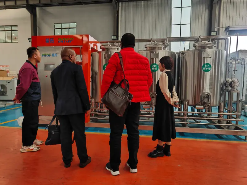 INTOP stabilisce con successo una linea di produzione di bevande con acqua purificata in Tanzania